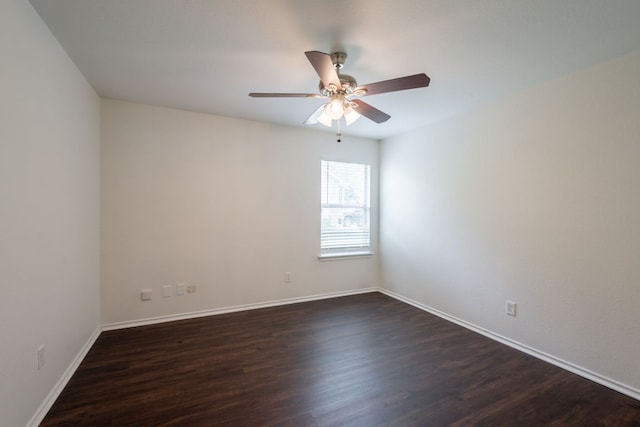 292 Dandelion Loop, Kyle, TX 78640 - spare room with dark wood finished floors, ceiling fan, and baseboards