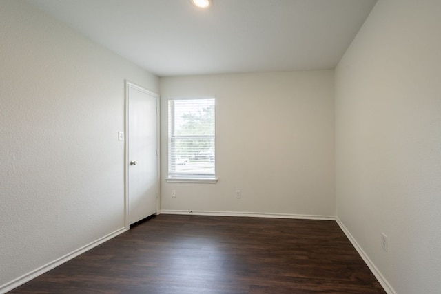 292 Dandelion Loop, Kyle, TX 78640 - unfurnished room featuring dark wood-style floors and baseboards