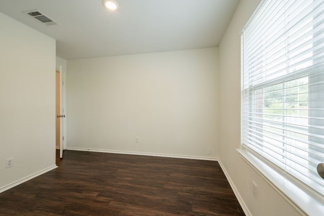 292 Dandelion Loop, Kyle, TX 78640 - empty room featuring dark wood-style floors, baseboards, and recessed lighting