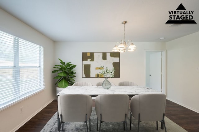 292 Dandelion Loop, Kyle, TX 78640 - dining room featuring a chandelier, dark wood-style flooring, and baseboards