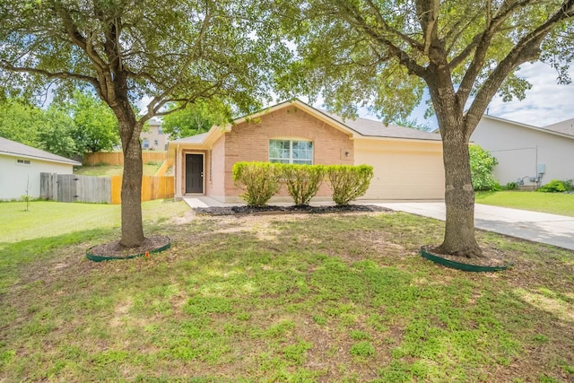 292 Dandelion Loop, Kyle, TX 78640 - ranch-style house with driveway, an attached garage, and brick siding