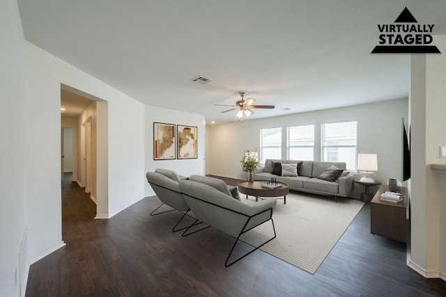 292 Dandelion Loop, Kyle, TX 78640 - living area with a ceiling fan and dark wood-style floors