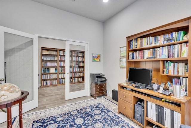 office space featuring baseboards, recessed lighting, and wood finished floors