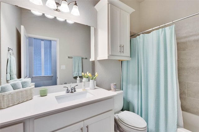 full bath featuring toilet, shower / tub combo, and vanity