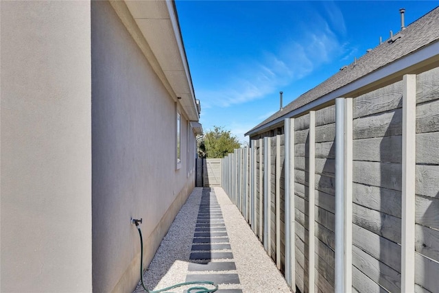 view of home's exterior featuring fence