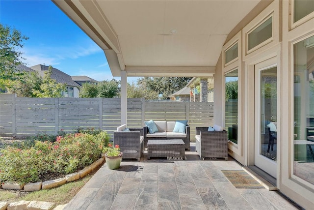 view of patio with a fenced backyard and outdoor lounge area