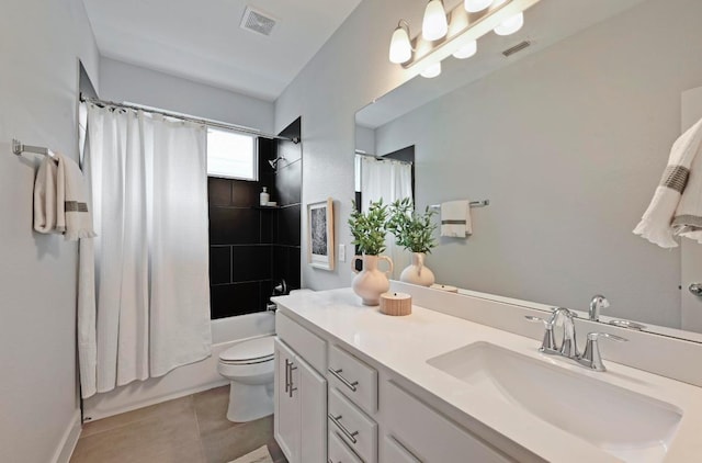 full bathroom with visible vents, vanity, tile patterned floors, toilet, and shower / bathtub combination with curtain