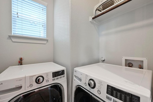 laundry area with laundry area and separate washer and dryer