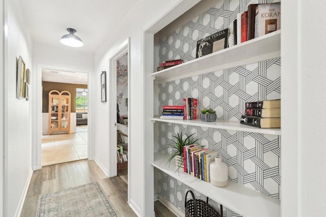 421 James St, Boerne, TX 78006 - corridor featuring wood finished floors and baseboards