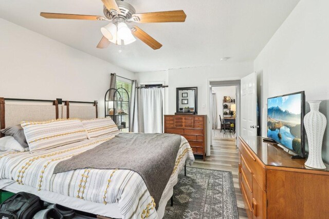 bedroom featuring ceiling fan and wood finished floors