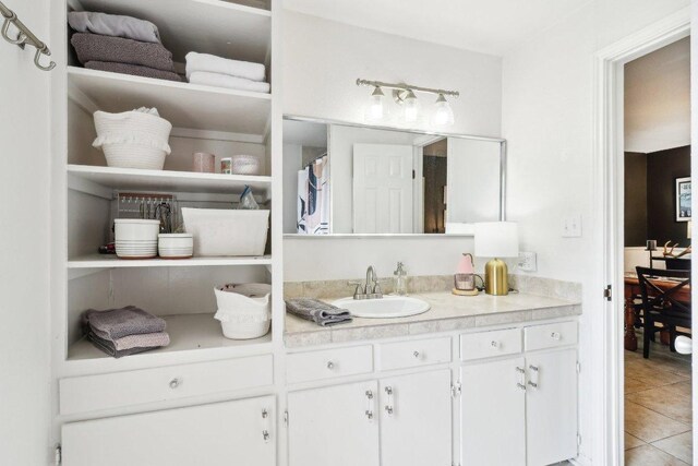 full bath featuring vanity and tile patterned floors