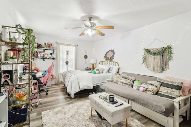 421 James St, Boerne, TX 78006 - bedroom with wood finished floors and ceiling fan