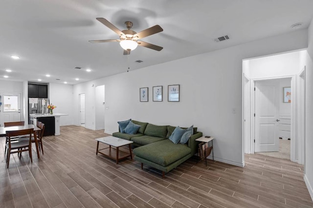 117 Thurman Holt Rd, Hutto, TX 78634 - living area featuring a ceiling fan, recessed lighting, and wood finished floors