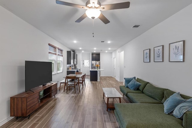 117 Thurman Holt Rd, Hutto, TX 78634 - living area with wood finished floors, recessed lighting, and ceiling fan