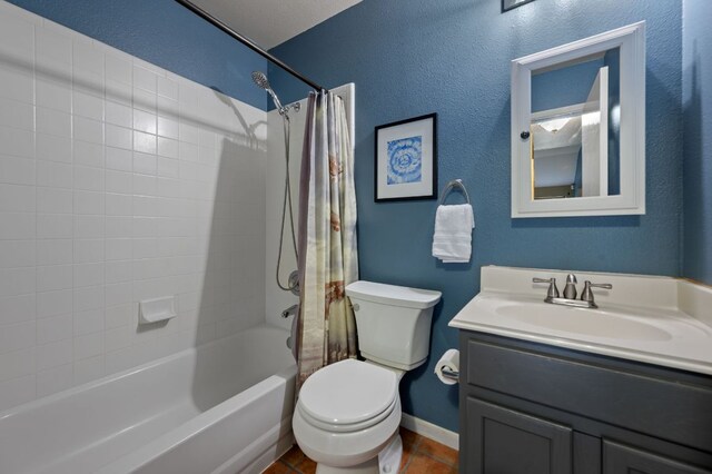 bathroom with shower / bath combo with shower curtain, tile patterned flooring, vanity, toilet, and baseboards