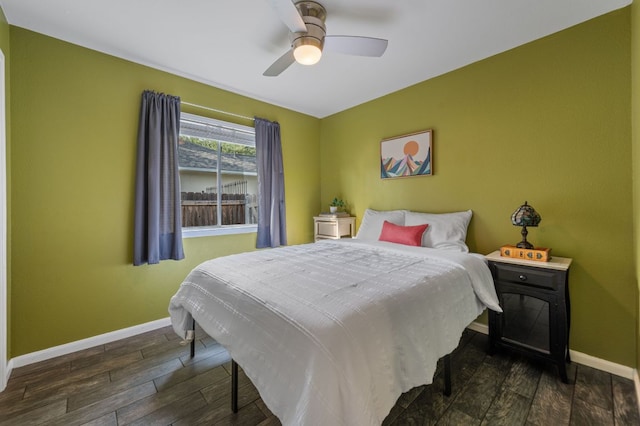 bedroom with baseboards, ceiling fan, and wood finished floors