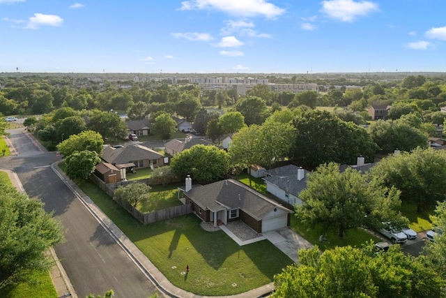 birds eye view of property with a residential view