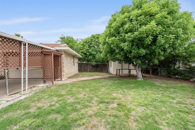 view of yard with a fenced backyard