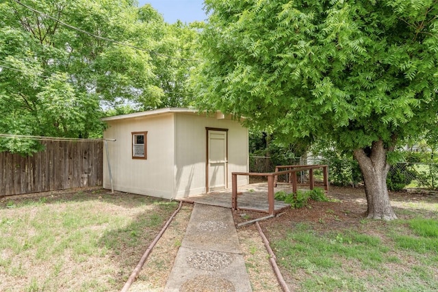view of shed with fence