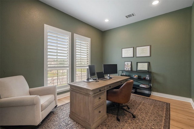 office area featuring recessed lighting, baseboards, visible vents, and light wood finished floors