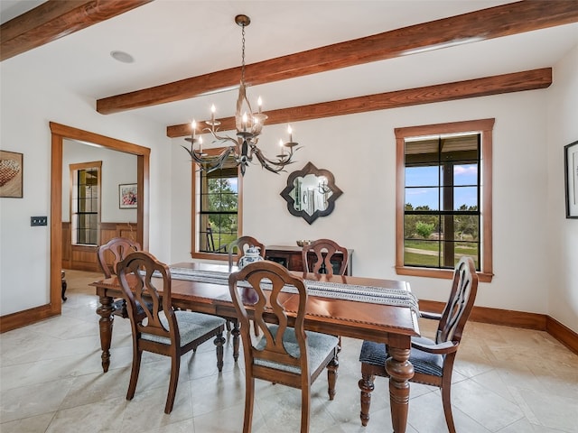 dining room featuring an inviting chandelier, baseboards, light tile patterned floors, and beamed ceiling