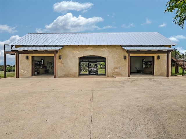 424 Hidden Creek Dr, Dripping Springs, TX 78620 - view of building exterior with a garage, stairs, and driveway