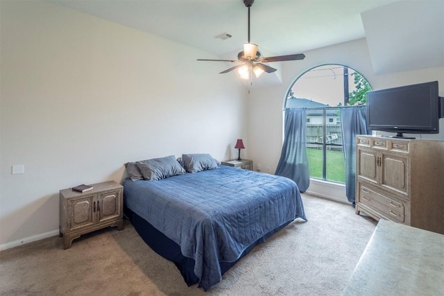 bedroom with baseboards, visible vents, multiple windows, and light carpet