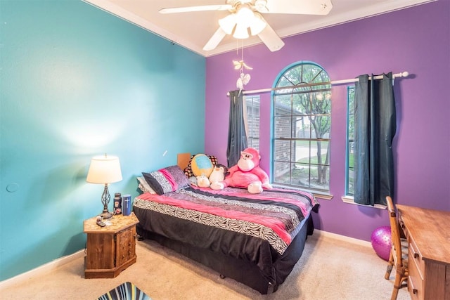 bedroom featuring baseboards, a ceiling fan, and carpet flooring