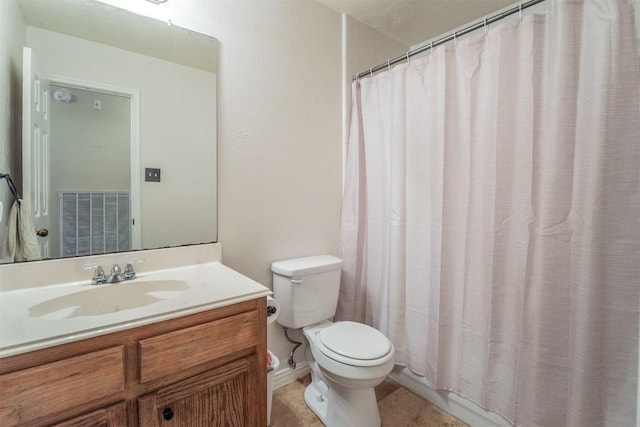 bathroom featuring visible vents, a shower with shower curtain, toilet, and vanity
