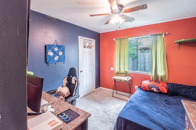 bedroom with ceiling fan, baseboards, and carpet