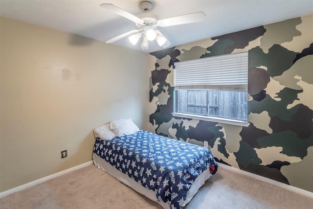 bedroom featuring a ceiling fan, baseboards, and carpet