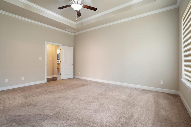 103 Lockhart Loop, Georgetown, TX 78628 - spare room with light colored carpet, a tray ceiling, a ceiling fan, crown molding, and plenty of natural light