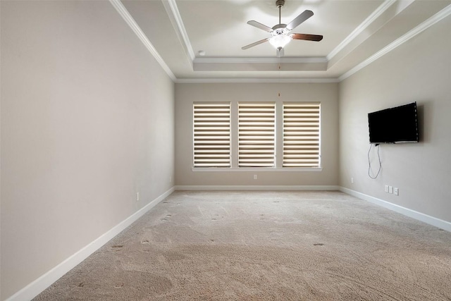 103 Lockhart Loop, Georgetown, TX 78628 - carpeted empty room with a tray ceiling, a ceiling fan, and crown molding