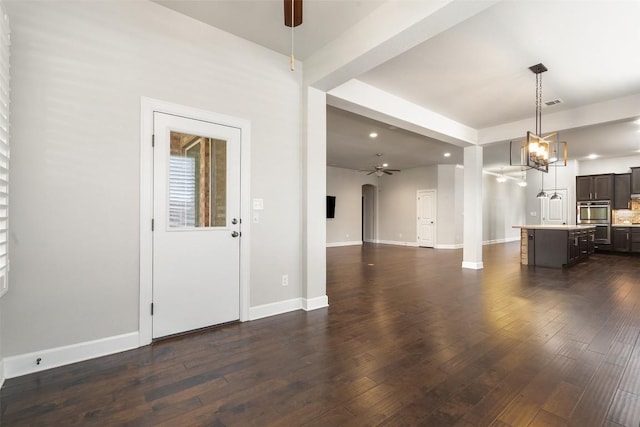 103 Lockhart Loop, Georgetown, TX 78628 - unfurnished living room featuring ceiling fan, dark wood-type flooring, a chandelier, and recessed lighting