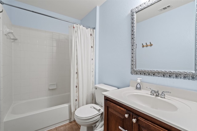 bathroom featuring toilet, visible vents, shower / tub combo with curtain, and vanity