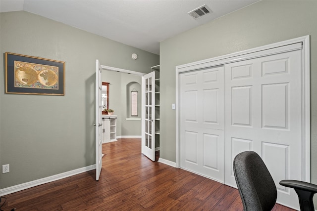 office space with baseboards, visible vents, french doors, and dark wood-type flooring