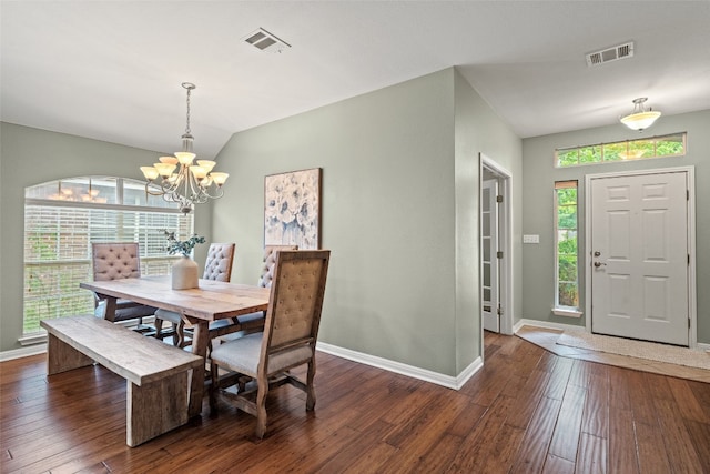 dining area featuring visible vents, baseboards, and hardwood / wood-style flooring