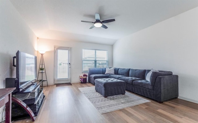 living room featuring a ceiling fan and wood finished floors