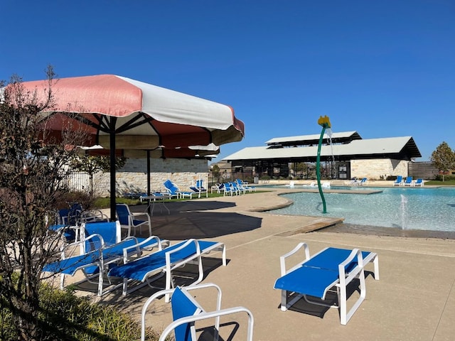 pool with a patio area