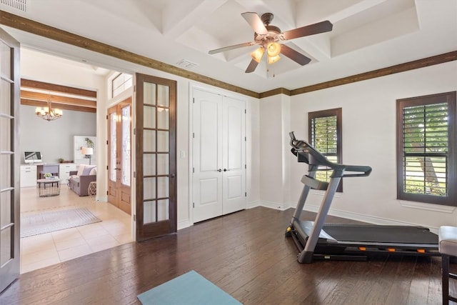 workout area featuring french doors, visible vents, hardwood / wood-style flooring, baseboards, and ceiling fan with notable chandelier