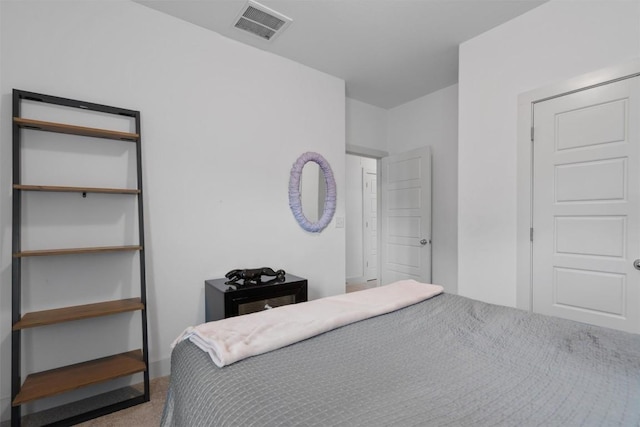 bedroom with carpet floors and visible vents