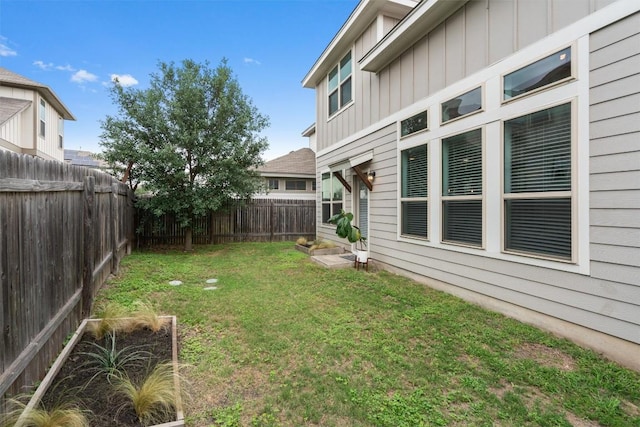 view of yard with a fenced backyard