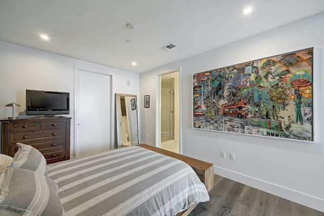 bedroom with visible vents, wood finished floors, baseboards, recessed lighting, and connected bathroom