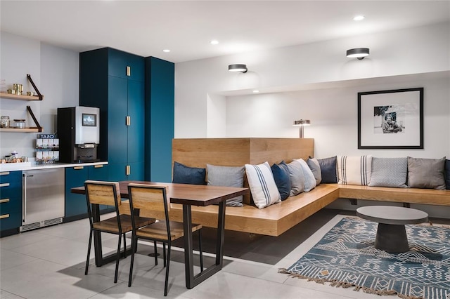 living area with a dry bar, recessed lighting, and breakfast area