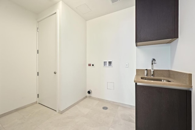501 W Ave Unit 2001, Austin, TX 78701 - laundry room featuring electric dryer hookup, washer hookup, cabinet space, and baseboards