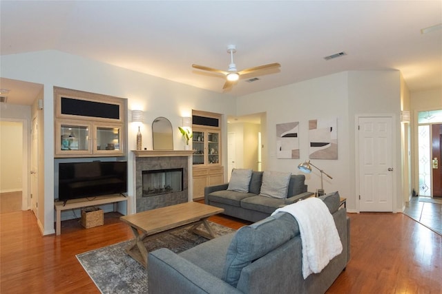 307 Deer Trace Cv, Cedar Park, TX 78613 - living room with wood finished floors, a fireplace, ceiling fan, and vaulted ceiling