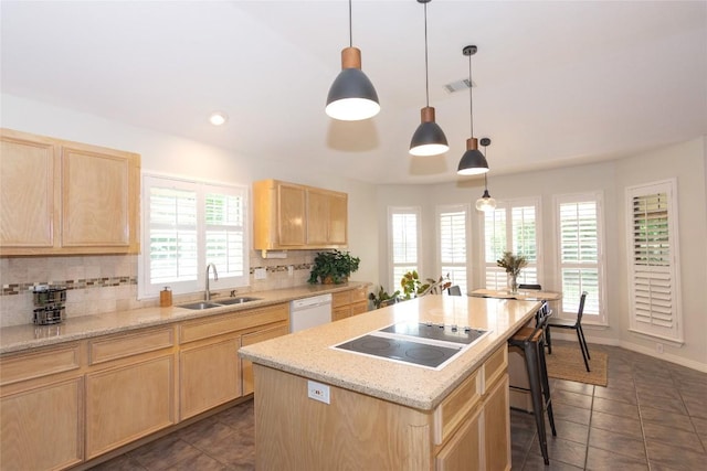 307 Deer Trace Cv, Cedar Park, TX 78613 - kitchen with light brown cabinets, black electric cooktop, white dishwasher, backsplash, and recessed lighting