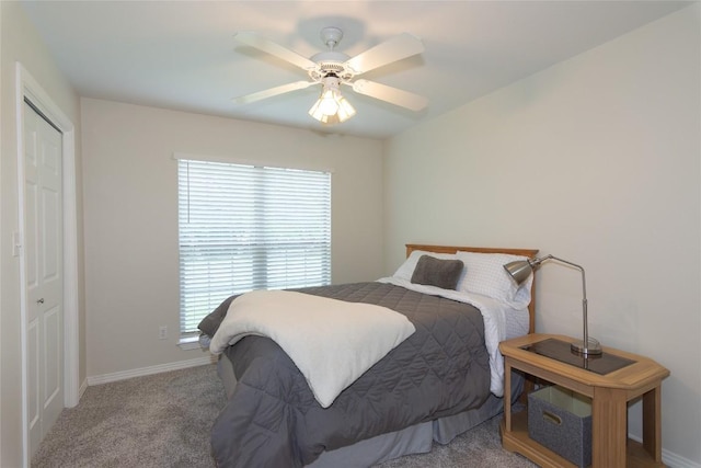 bedroom with baseboards, carpet flooring, and ceiling fan