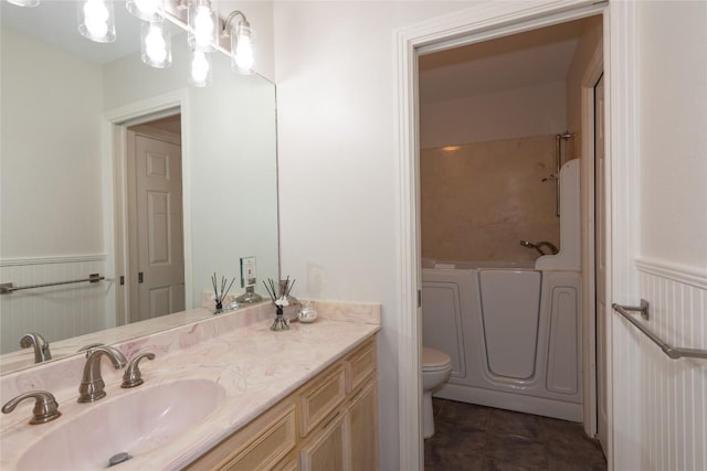 307 Deer Trace Cv, Cedar Park, TX 78613 - bathroom with wainscoting, vanity, a bathtub, tile patterned flooring, and a shower