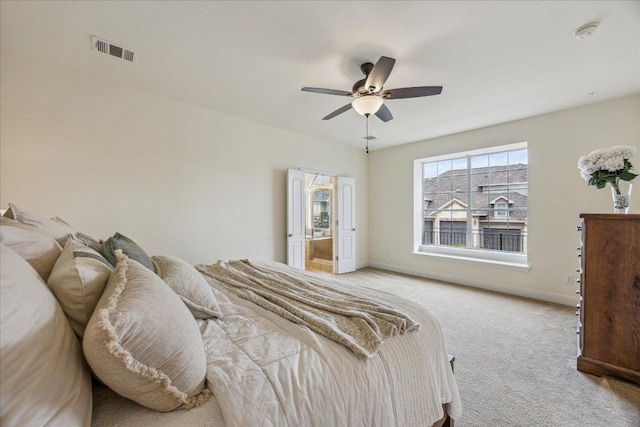 bedroom with carpet floors, baseboards, visible vents, and ceiling fan